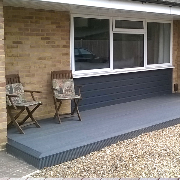 Image shows composite decking installed by garden decking contractors