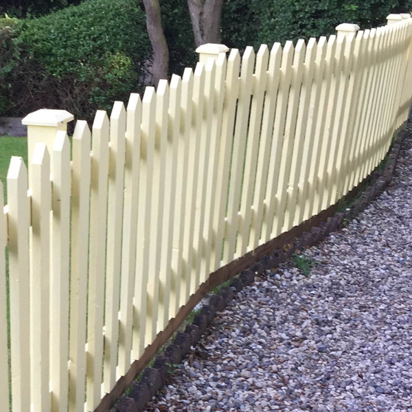 Image shows picket fencing installed by fencing contractors